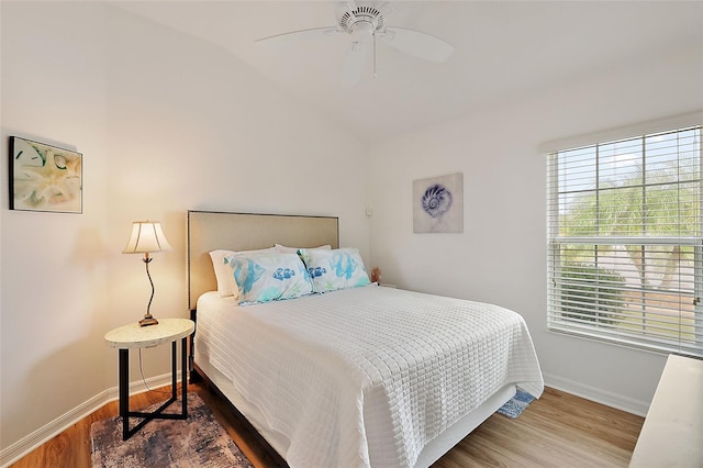 bedroom featuring wood-type flooring, ceiling fan, and lofted ceiling