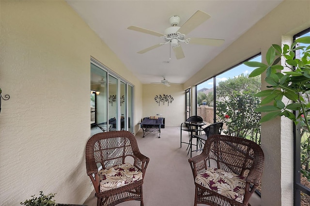 sunroom / solarium with ceiling fan