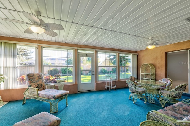 sunroom with ceiling fan and a healthy amount of sunlight