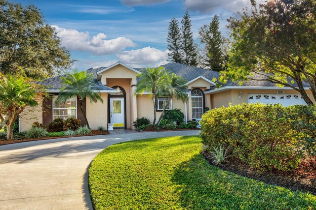 ranch-style house featuring a garage