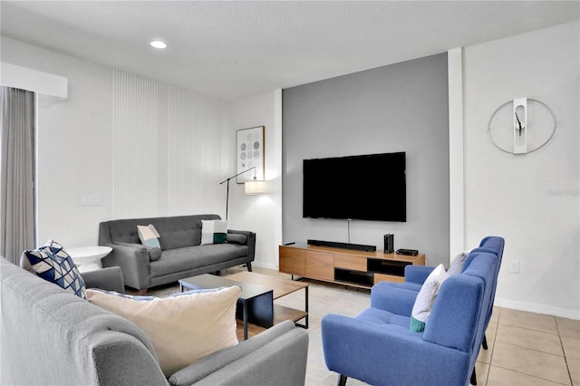 living room with light tile patterned floors and a textured ceiling