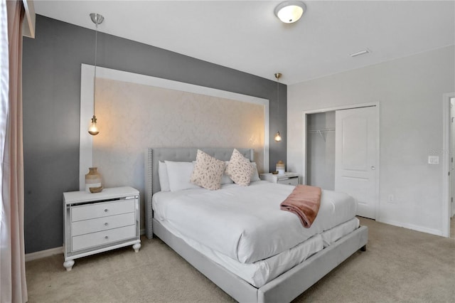 bedroom featuring light colored carpet and a closet