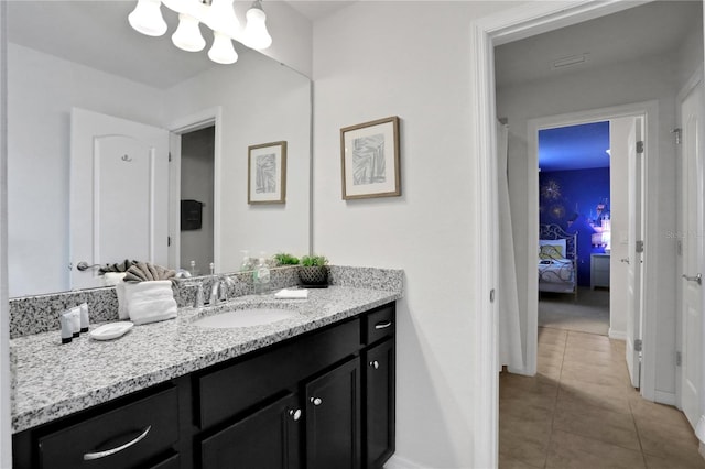 bathroom with tile patterned flooring and vanity