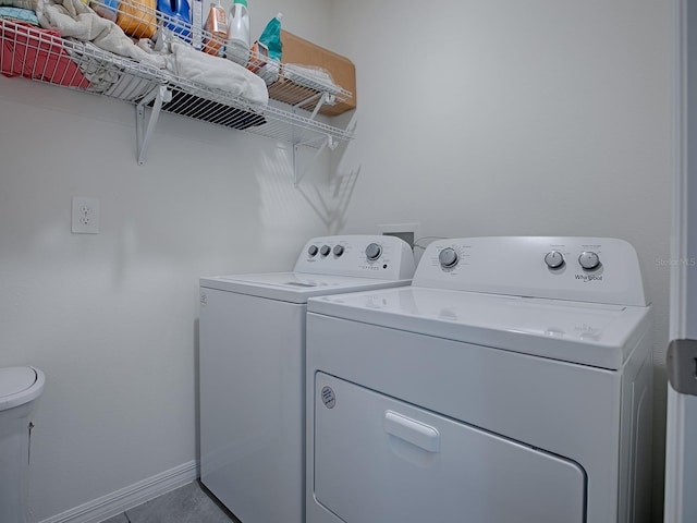 washroom featuring washer and dryer