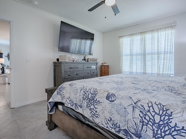 bedroom featuring ceiling fan and light tile patterned floors