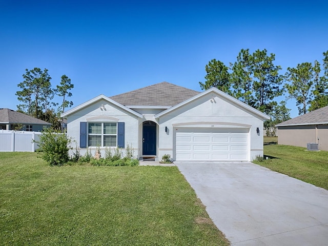 single story home featuring a garage and a front yard