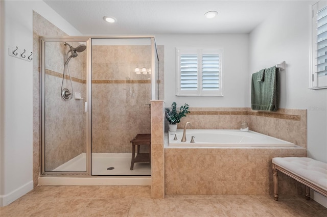 bathroom with separate shower and tub and tile patterned floors