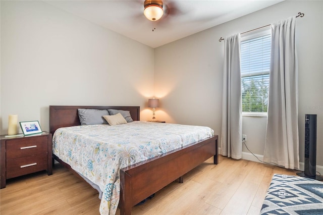 bedroom featuring light wood-type flooring and ceiling fan