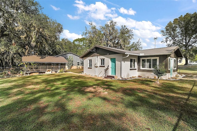 view of side of property featuring a lawn