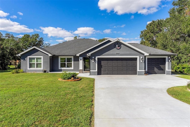 single story home with a garage and a front yard