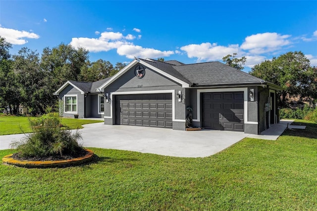 single story home featuring a front lawn and a garage