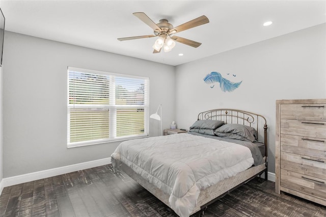 bedroom featuring dark hardwood / wood-style flooring and ceiling fan