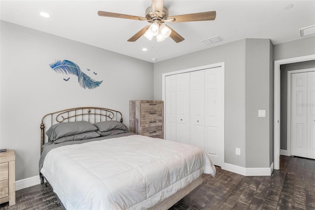 bedroom with a closet, ceiling fan, and dark hardwood / wood-style flooring