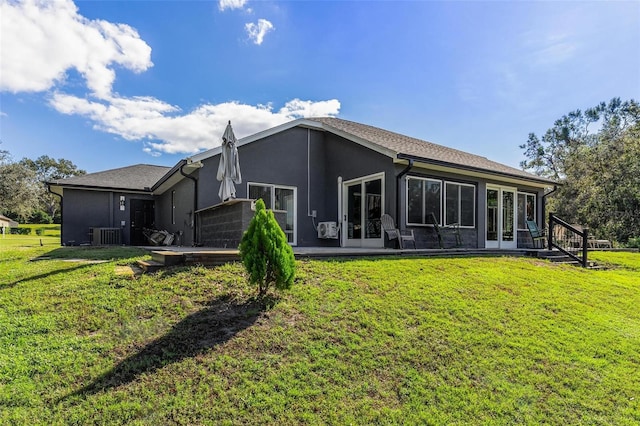 back of house with a yard