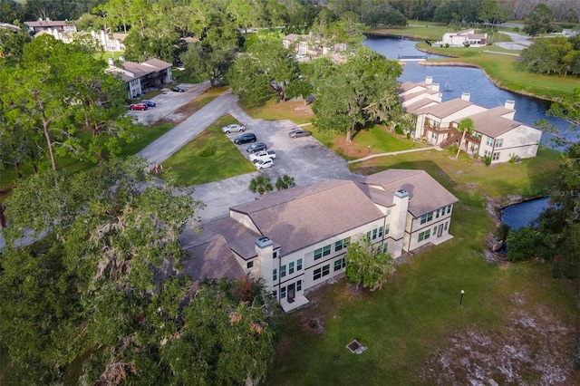 birds eye view of property with a water view