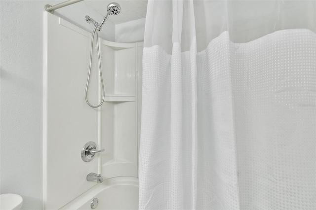 bathroom featuring shower / bath combo with shower curtain