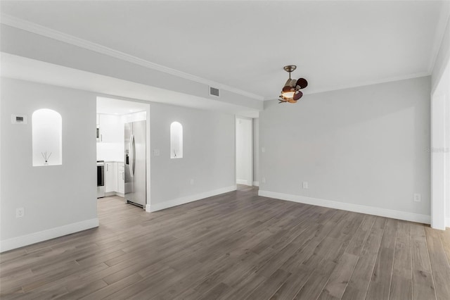 unfurnished living room with ornamental molding and light wood-type flooring