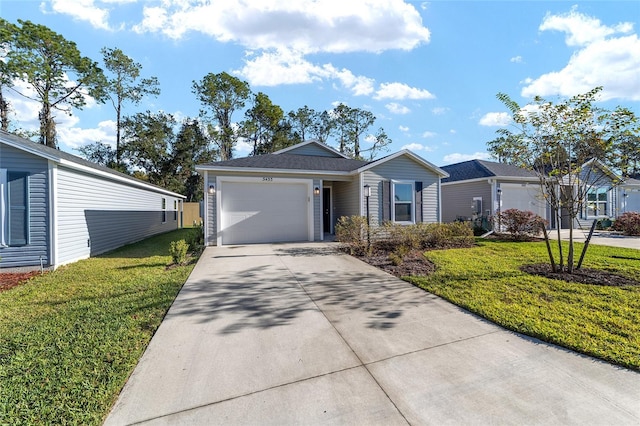 ranch-style home featuring a garage and a front lawn