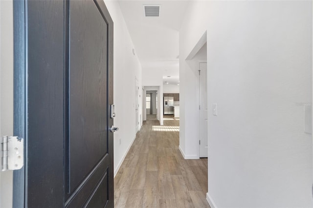 hallway featuring light hardwood / wood-style floors