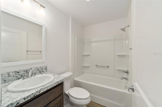 full bathroom with shower / bathing tub combination, vanity, toilet, and a textured ceiling