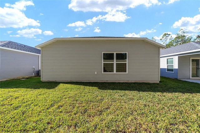 view of home's exterior with a yard