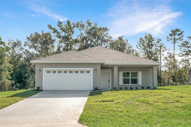 view of front of home with a garage and a front yard