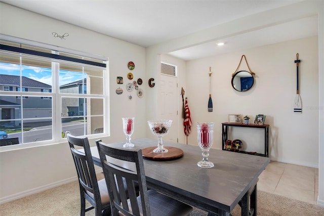 dining area with light carpet