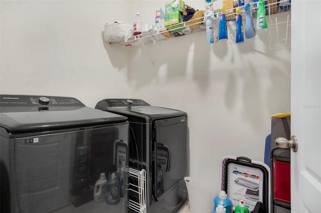 laundry room with washing machine and clothes dryer