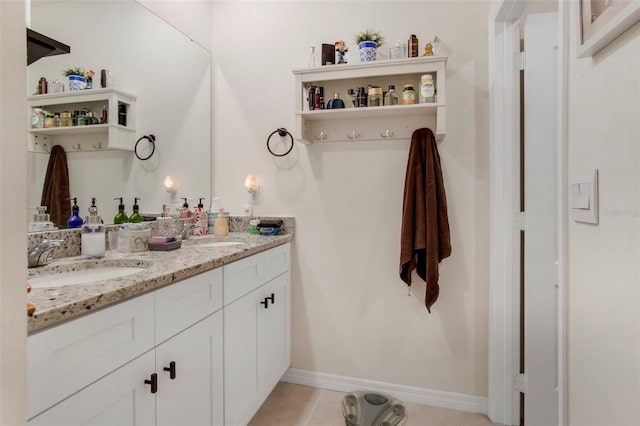 bathroom with tile patterned flooring and vanity