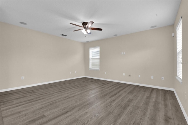 empty room featuring ceiling fan and hardwood / wood-style floors