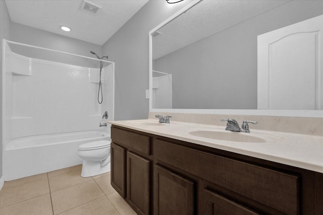 full bathroom with tile patterned floors, shower / bath combination, a textured ceiling, toilet, and vanity