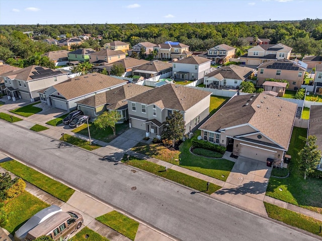 birds eye view of property with a residential view