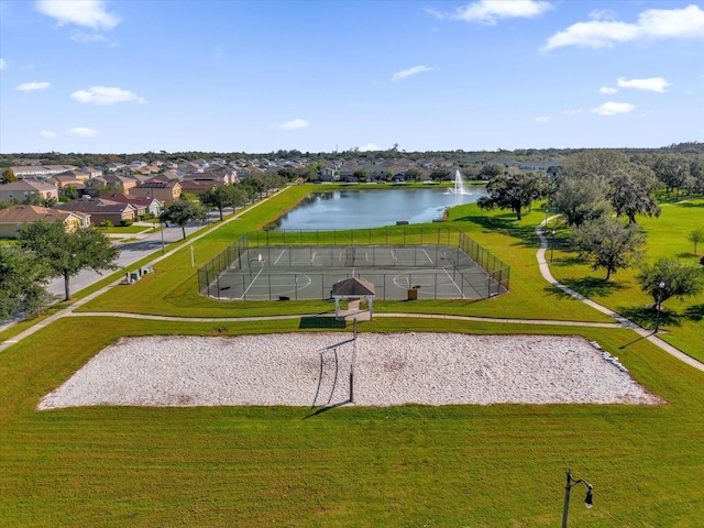 view of property's community featuring volleyball court, a water view, and a residential view