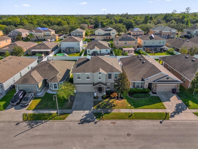 birds eye view of property with a residential view