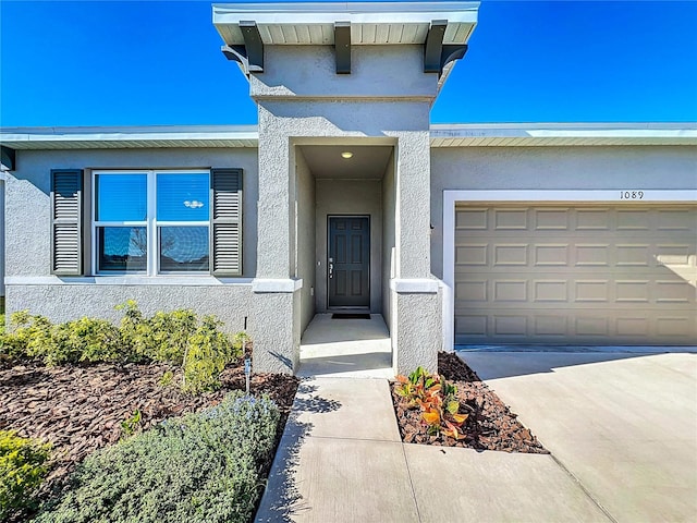 view of exterior entry featuring a garage