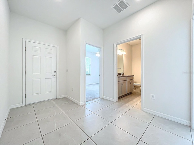 interior space with light tile patterned floors