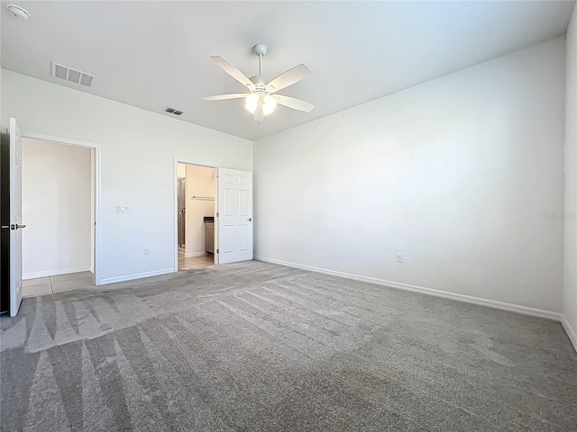 unfurnished bedroom with ceiling fan and carpet