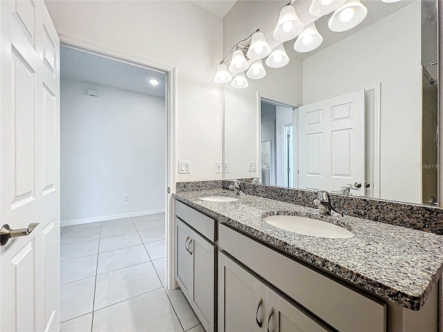 bathroom with tile patterned flooring and vanity