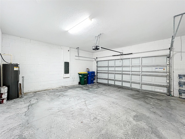 garage featuring electric panel, electric water heater, and a garage door opener