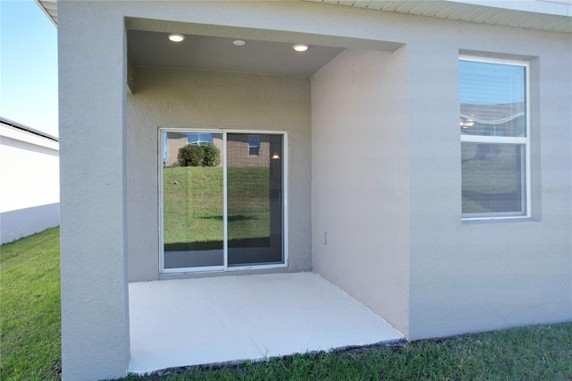 property entrance with a patio