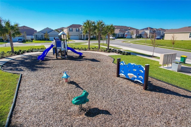 view of jungle gym featuring a lawn