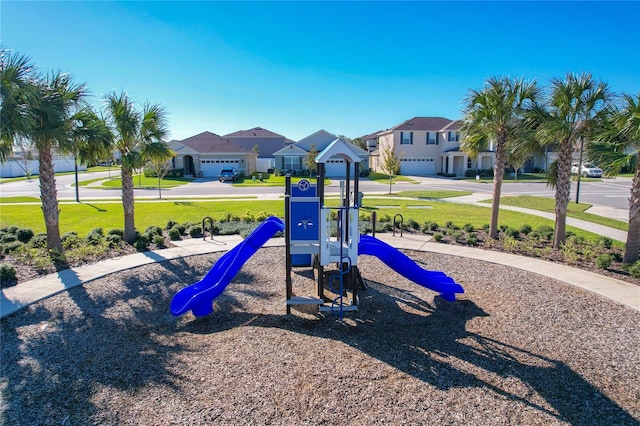 view of jungle gym with a lawn