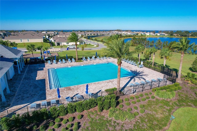 view of pool with a water view