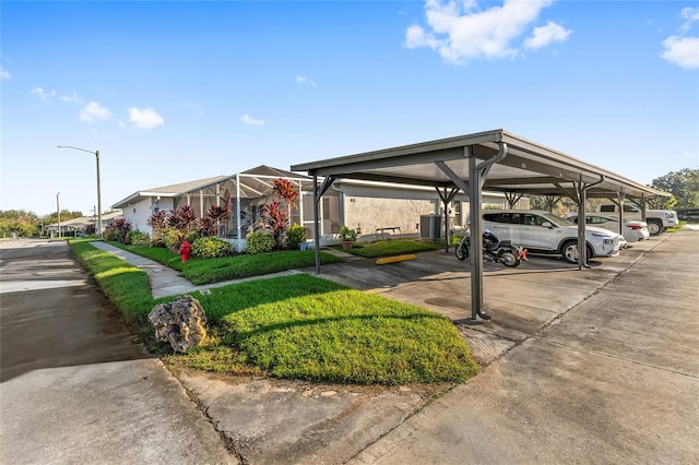 view of vehicle parking with a carport