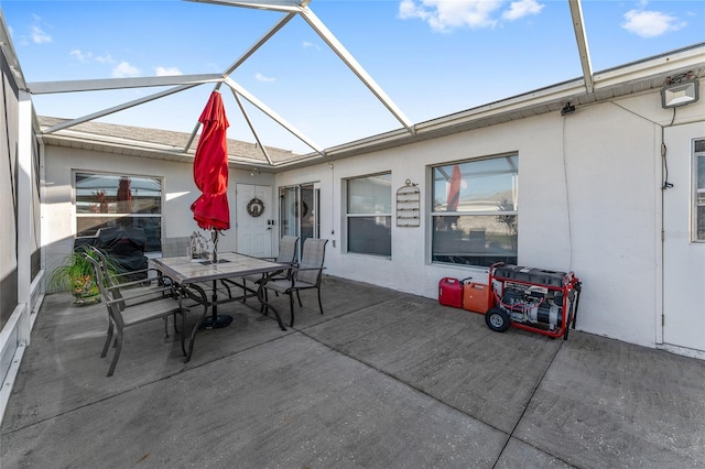 view of patio / terrace featuring glass enclosure