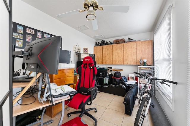 tiled office featuring ceiling fan