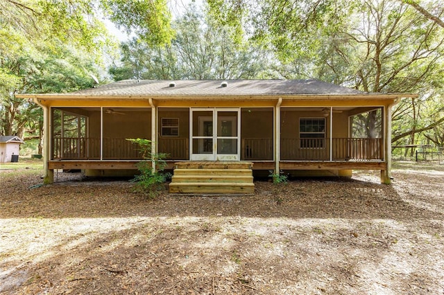 view of front of home featuring a sunroom