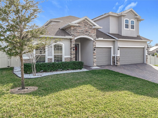 view of front of home featuring a front yard and a garage