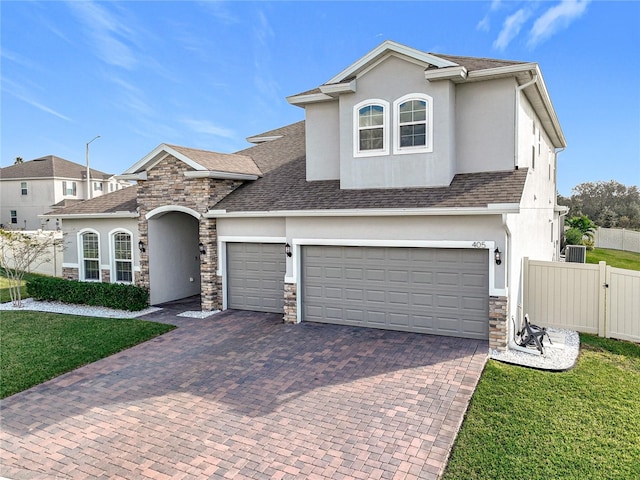 view of front facade with a front yard and a garage