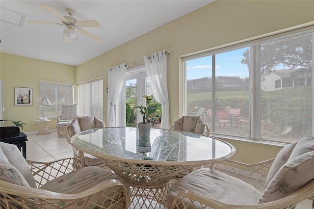 dining room featuring a mountain view, light tile patterned floors, and ceiling fan